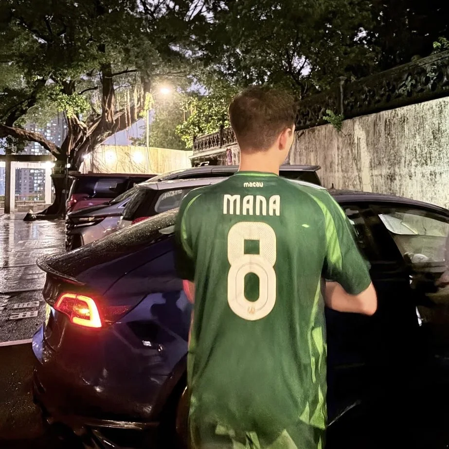 The back of Mana Azizsoltani's custom Macau football jersey with his name and number eight