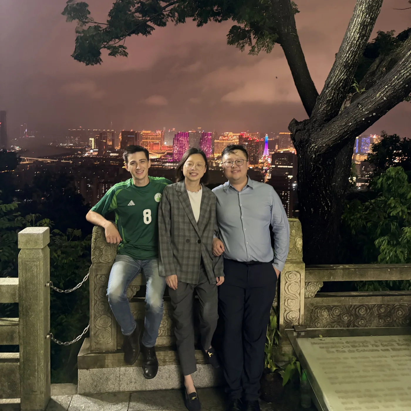 Mana Azizsoltani with friends overlooking the Macau skyline at night