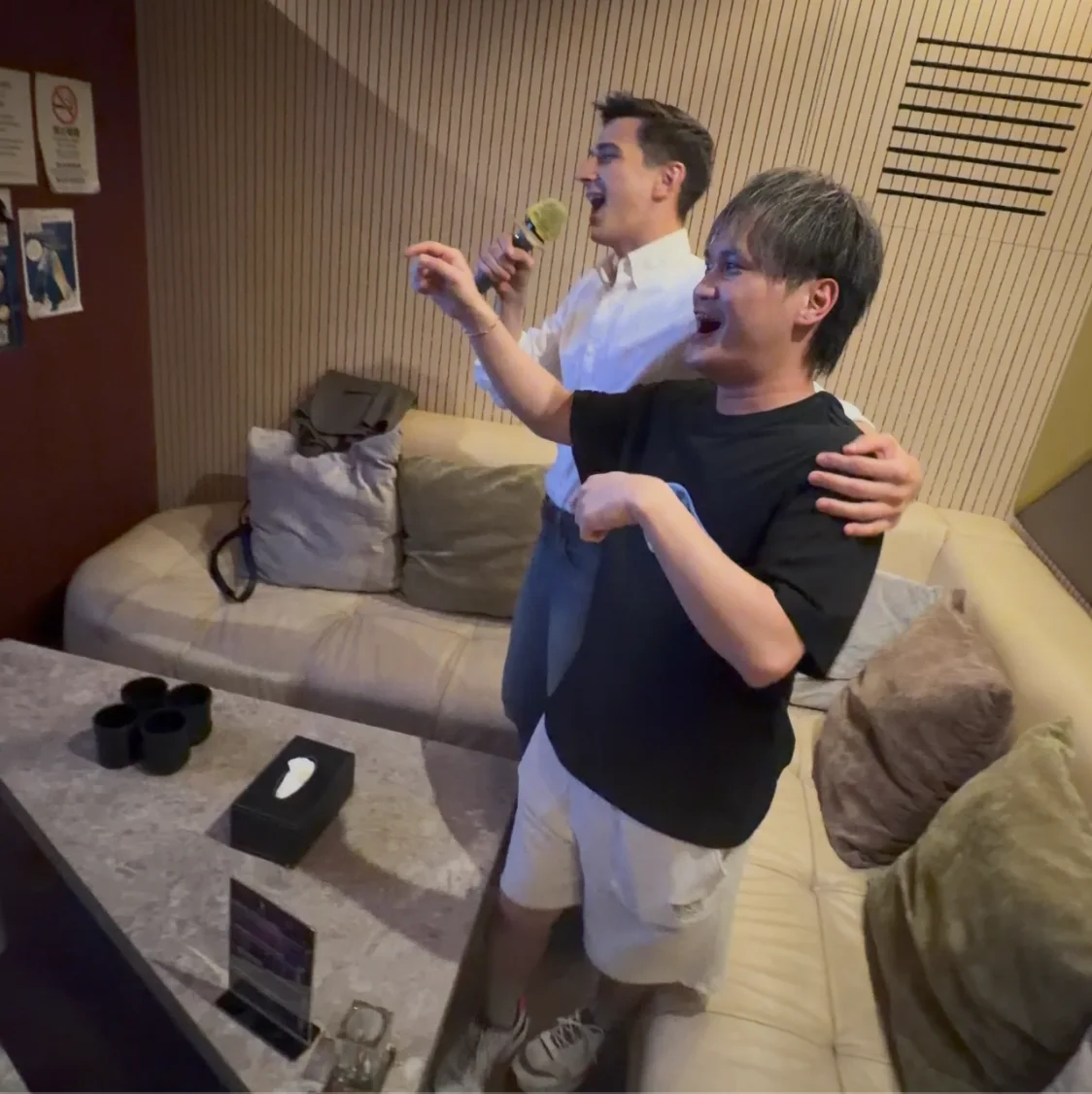 Mana Azizsoltani singing karaoke with a local friend in Macau