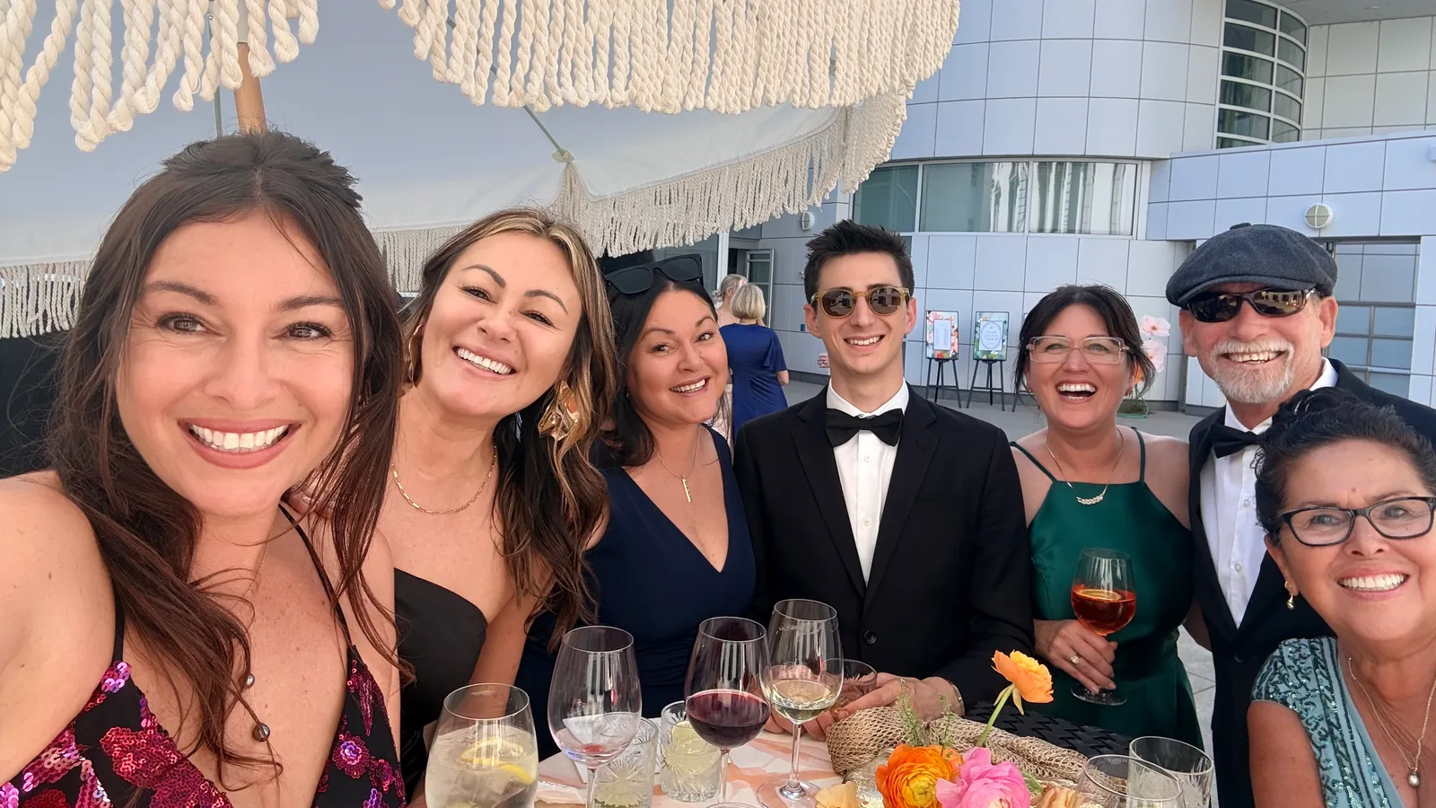 Family and friends gathered around a table at Wyatt’s wedding